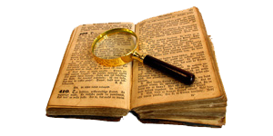 Old book with magnifying glass